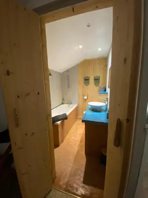 a bathroom with a tub and a toilet and a sink at Joli gîte chic et cosy entre mer et Narbonne in Narbonne