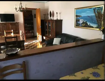 a living room with a couch and a table at Grand Appartement 6 pers,lumineux,avec terrasse Sud de France in Tuchan