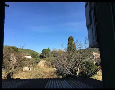 a view from a window of a field with trees at Grand Appartement 6 pers,lumineux,avec terrasse Sud de France in Tuchan