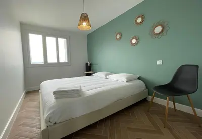 a bedroom with a bed and a shower in it at Appartement cosy avec vue imprenable sur la cité in Carcassonne