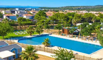 an overhead view of a swimming pool at a resort at Cathy & David-Mobile Home 11-Camping Novela in Port-la-Nouvelle