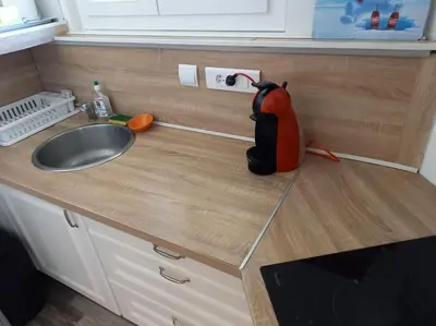 a kitchen counter with a sink and a mixer on it at Cosy T2, Meublé de tourisme 3 étoiles, Parking fermé , 2Vélos, Wi-Fi in Narbonne