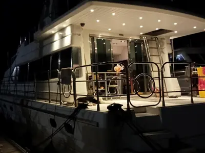 a boat is lit up at night at Loc de cabines sur Yacht in Gruissan