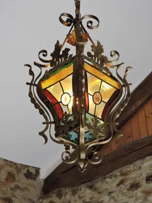 a chandelier hanging from a ceiling at Gîte LA FENIAL in Montredon-Labessonnié