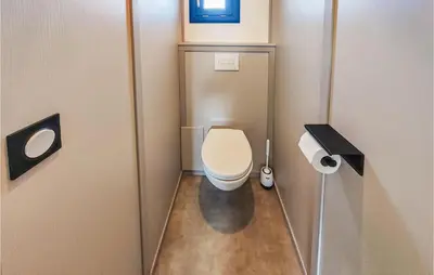 a small bathroom with a toilet in a stall at Gorgeous Home In Olonzac With Kitchen in Olonzac