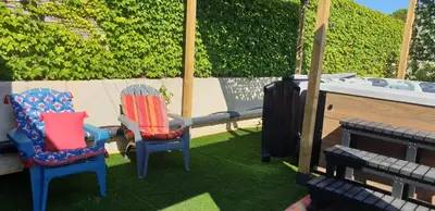 two chairs sitting on the grass in a yard at L'Annexe in Sigean