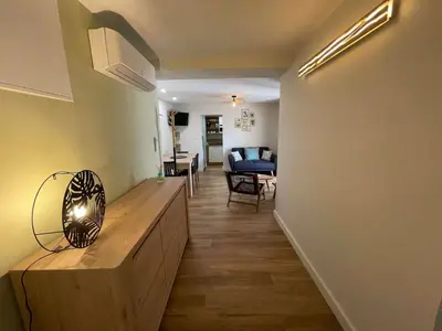 a hallway with a living room and a dining room at Au point du jour - Gîtes Carcassonne, Lac de la Cavayère in Carcassonne