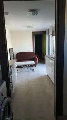 a view of a living room with a couch at Tranquillité Gite in Cuxac-dʼAude