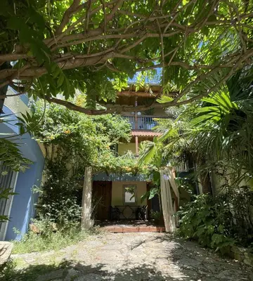 a view of the house from the garden at Autour d'une Toile in Rouvenac
