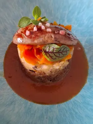 a sandwich with meat and vegetables on a plate at Le Mas Victoria - Chambres d'hôtes avec table d'hôtes-Parking privé ferme in Carcassonne