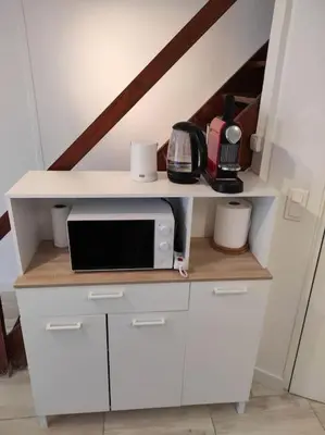 a kitchen with a white counter with a microwave at T2 Duplex Pamiers Plein Centre - Logement entier - Nouveau in Pamiers