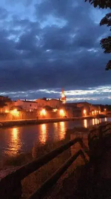 a view of a city at night with lights at L'Ancestrale, Beau T2 in Limoux