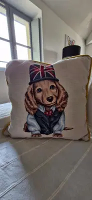 a pillow with a picture of a teddy bear on a bed at La Robine in Narbonne
