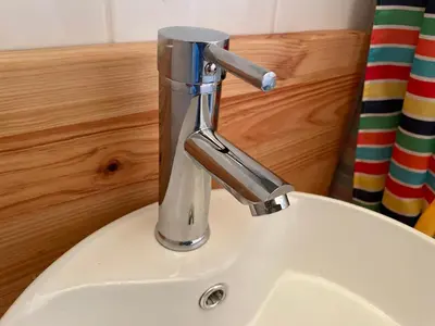 a bathroom sink with a faucet on a white sink at Maison de l´amitié Homps in Homps