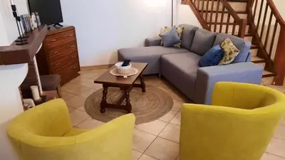 a living room with a couch and two chairs at A 200 mètres du château : maison de ville in Carcassonne