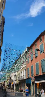 a building with a lot of shoes hanging over it at A 200 mètres du château : maison de ville in Carcassonne