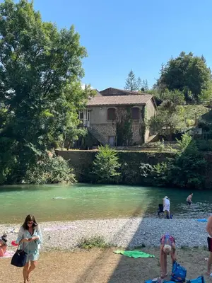 a group of people walking on the beach near a river at Cosy Camon Bolt-Hole in Camon