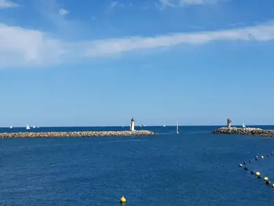 two islands in the ocean with boats in the water at Domaine de Livière-Haute Narbonne in Narbonne