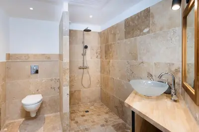 a bathroom with a sink and a toilet at Longue Vie Au Roi - Vue Enchanteresse in Carcassonne