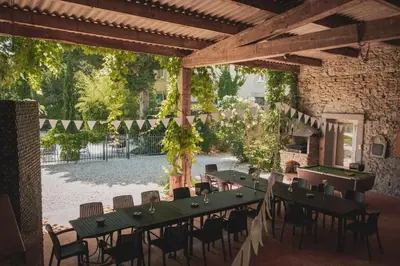 a pool table with a ball on top of it at Le Manoir d'Amiel a secret 16 bedroom garden oasis for groups up to 30 in Villegailhenc