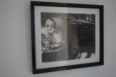 a black and white picture of a car on a wall at Le 100 in Carcassonne
