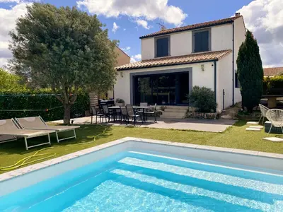 a swimming pool in front of a house at Carcalove - Pool, Billard & Jacuzzi - 10pax in Fontiès-dʼAude