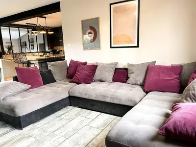 a living room with a couch with purple pillows at Carcalove - Pool, Billard & Jacuzzi - 10pax in Fontiès-dʼAude