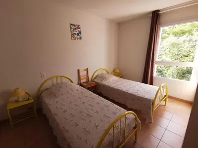 a bedroom with two beds and a window at Rouvenac in Trilla