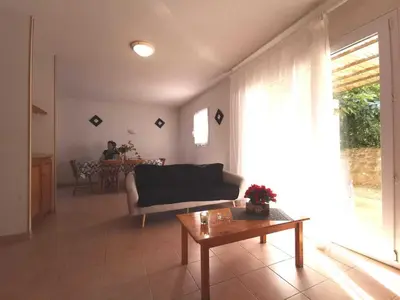 a living room with a couch and a table at Rouvenac in Trilla