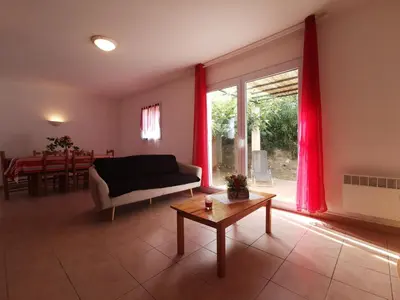 a living room with a couch and a table at Lou soula in Trilla