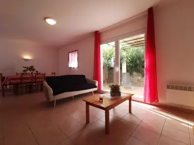 a living room with a couch and a table at Lou soula in Trilla