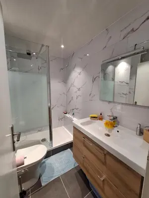 a bathroom with a shower and a sink and a tub at Chaleureux studio en bord de mer in Port-la-Nouvelle