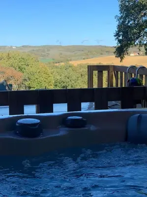 a pool of water with two balls in it at Gite à la ferme avec jacuzzi et piscine chauffée in Saint-Félix-de-Tournegat