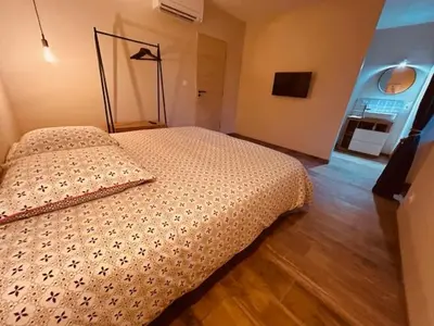 a bedroom with a bed in a room at Gites entre 2 rives in Montolieu