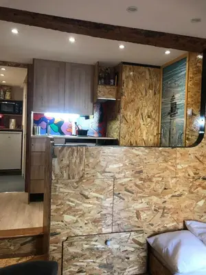 a kitchen with a stone counter top in a room at New Boat in Narbonne