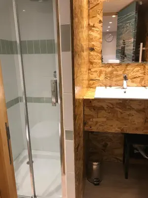 a bathroom with a sink and a shower at New Boat in Narbonne
