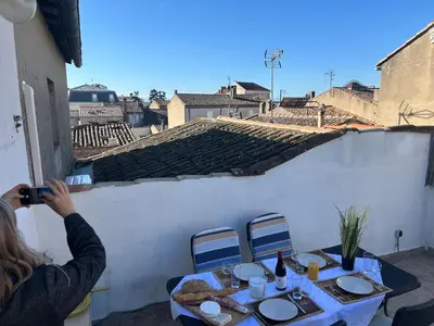 a castle at night with trees in the foreground at Centre Carcassonne apartment with private sunny terrace in Carcassonne