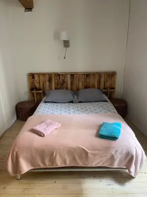 a bedroom with a bed with two towels on it at Studio in Carcassonne
