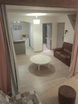 a living room with a table and a couch at Studio in Carcassonne