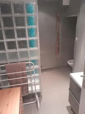 a bathroom with a towel rack and a toilet at Studio in Carcassonne