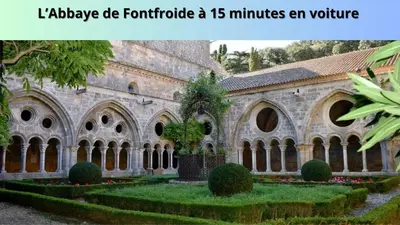 an old building with a garden in front of it at Le Cosy in Narbonne