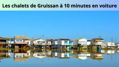 a group of houses on a body of water at Le Cosy in Narbonne