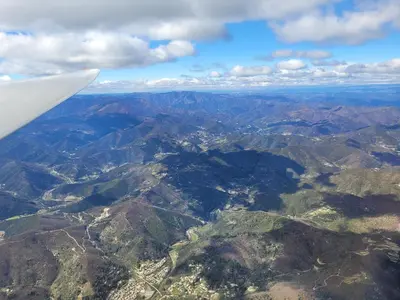 an aerial view of mountains from an airplane at B&B BonjourSoleil in Tourouzelle