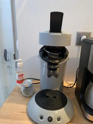 a coffee maker sitting on top of a counter at La Roche - Studio 2 étoiles Eco Responsable avec Tv Connectée in Maury