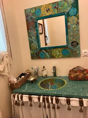 a bathroom with a sink and a mirror at Chalet de charme in Montfort-sur-Boulzane