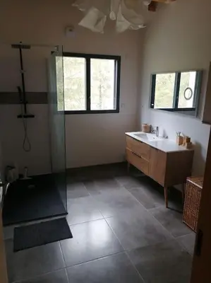 a bathroom with a shower and a tub and a sink at Magnifique villa avec piscine, jacuzzi et billard in Limoux