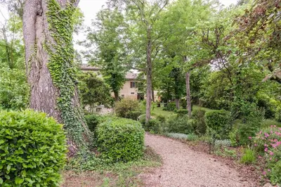 a garden path with a house in the background at Gîte - Holiday Home Vent Autan in Limoux