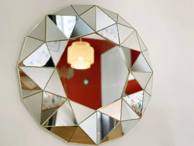 a mirror with a reflection of a red door at L'alcôve - T2 Calme, Terrasse & Parking privé in Castres
