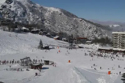 a group of people on a ski slope in the snow at Maison Richelieu in Bram