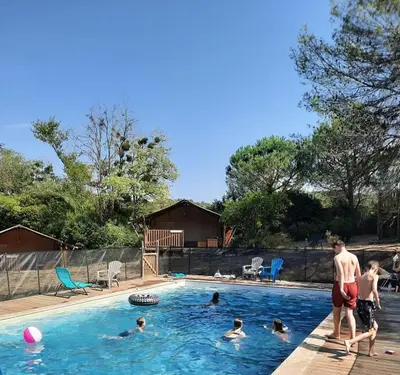 a group of people in a swimming pool at Domaine La Sauzette in Palaja